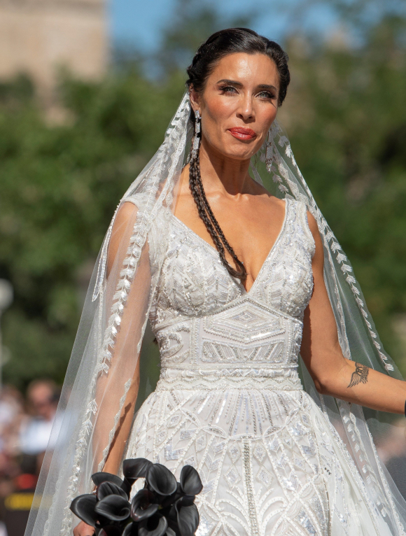 Triturado hogar flotante El vestido de novia de Pilar Rubio: blanco, de pedrería y con un recogido  de trenzas