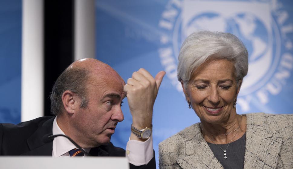 Luis de Guindos, y la exdirectora gerente del FMI, Christine Lagarde. / EFE