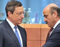 Mario Draghi y Luis de Guindos.